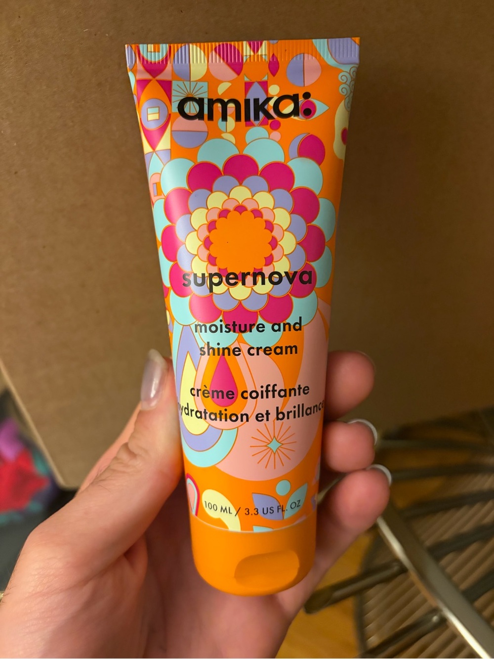 amika Supernova Moisture & Shine Cream - Orange with Pink and Aqua Accents